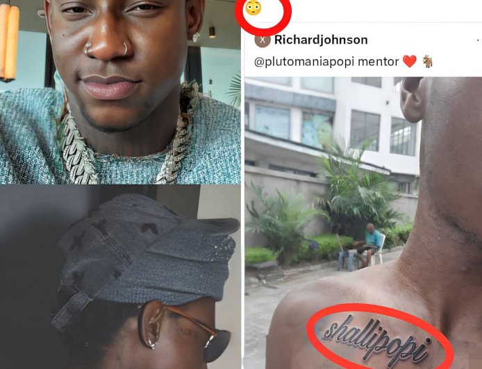 Shallipopi Left Speechless After Fan Tattoos His Name Across Chest   Shallipopi appeared stunned after a fan revealed a large tattoo of the artist’s name boldly inked on his chest. Instead of excitement, the singer’s reaction suggested surprise and disbelief at the extreme show of support.